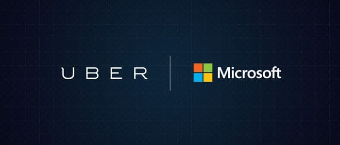 Uber- og Microsoft-logoene side om side på mørk bakgrunn